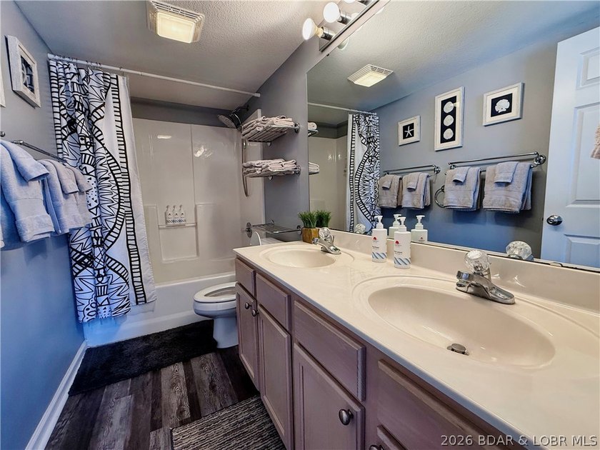 Lake life just got a serious glow-up! This beautifully remodeled - photo 31
