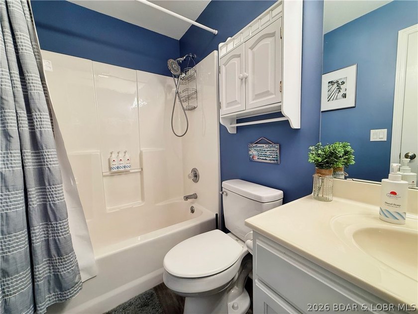 Lake life just got a serious glow-up! This beautifully remodeled - photo 37