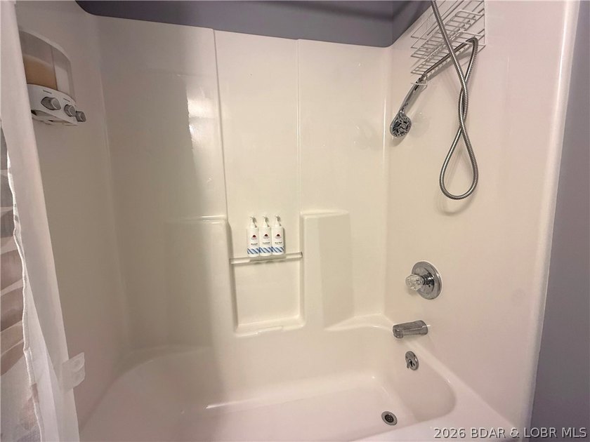 Lake life just got a serious glow-up! This beautifully remodeled - photo 38