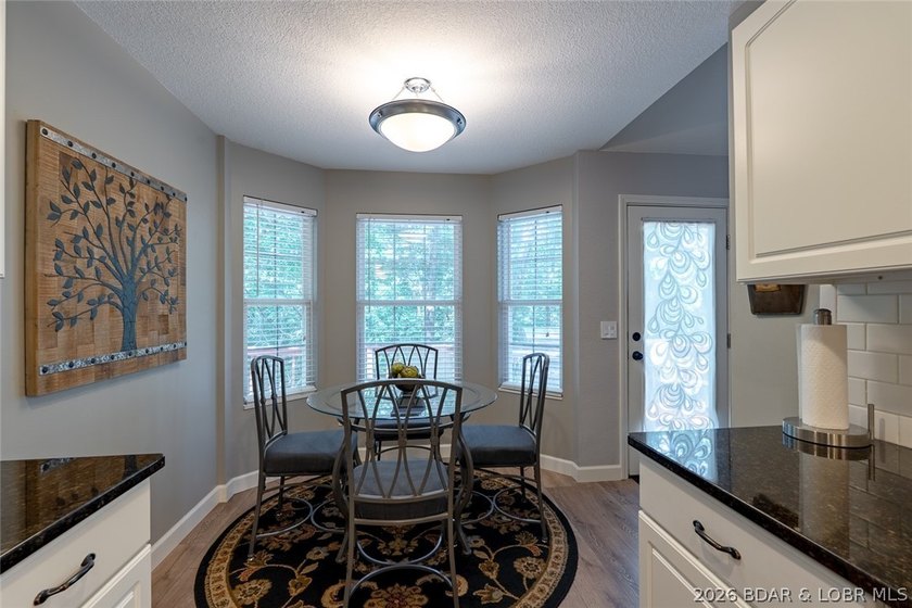 Located on a quiet cul-de-sac w/seasonal lake view in the highly - photo 13
