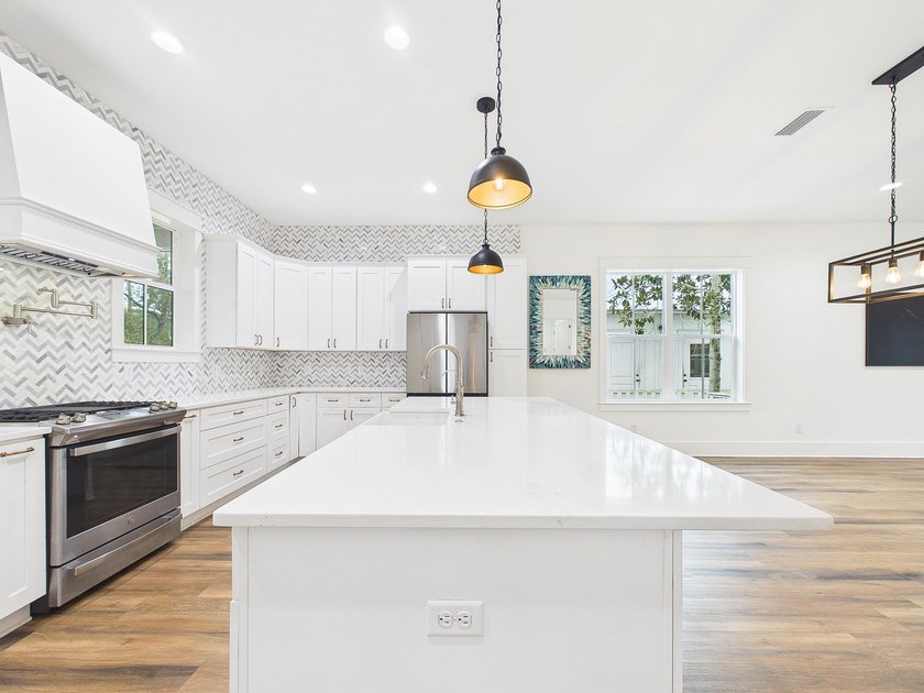 Discover coastal charm and modern luxury in this stunning Point - photo 21