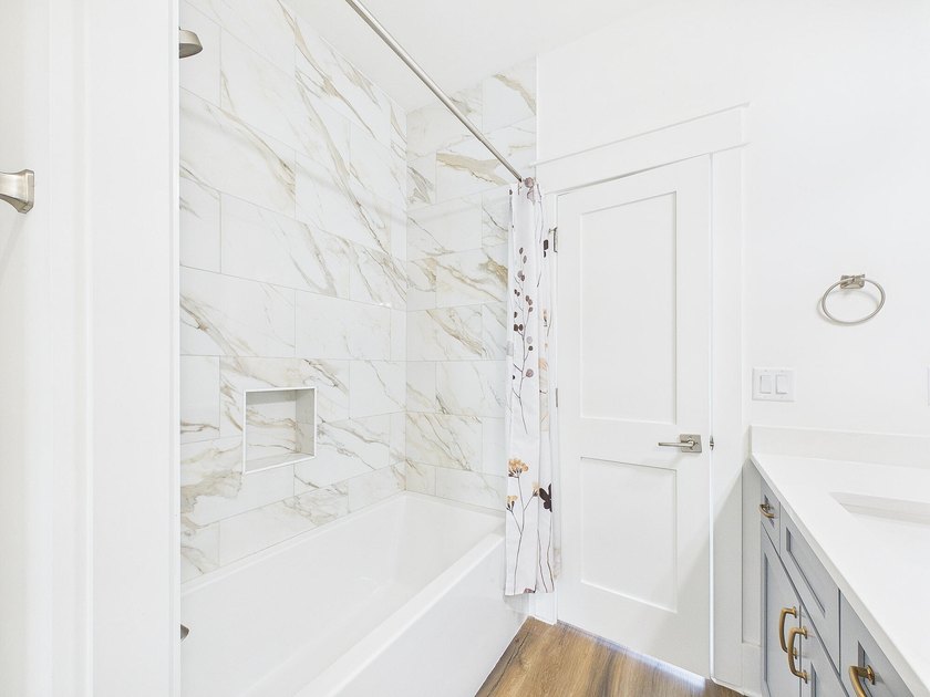 Discover coastal charm and modern luxury in this stunning Point - photo 35