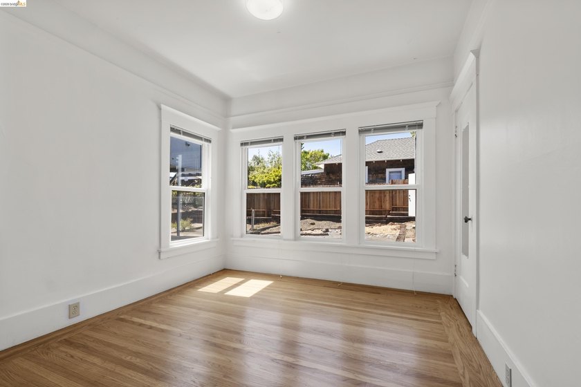This beautifully preserved 1910 duplex blends timeless character - photo 11