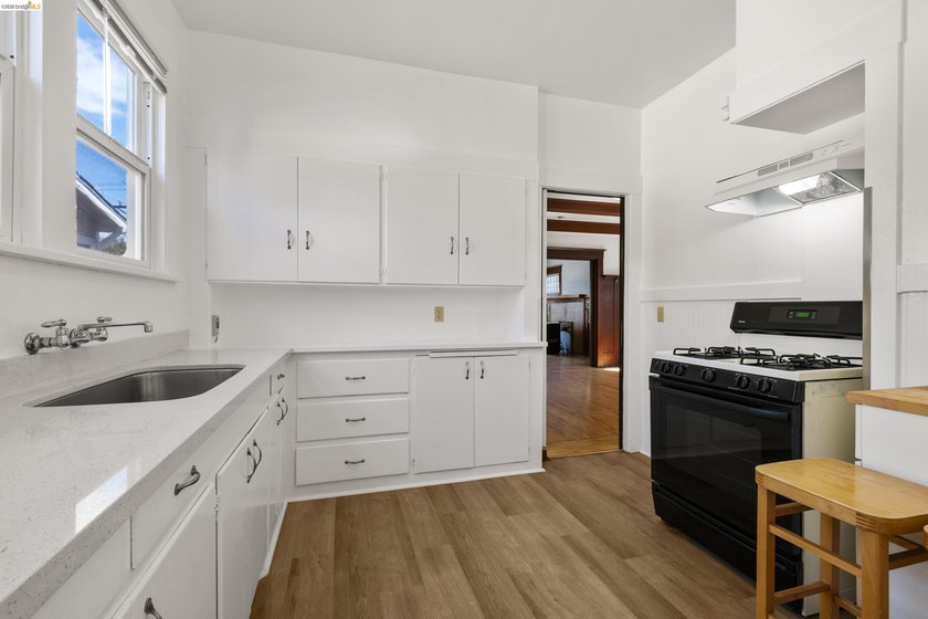 This beautifully preserved 1910 duplex blends timeless character - photo 13