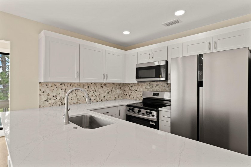 Lake front! This freshly updated condo offers a comfortable and - photo 11