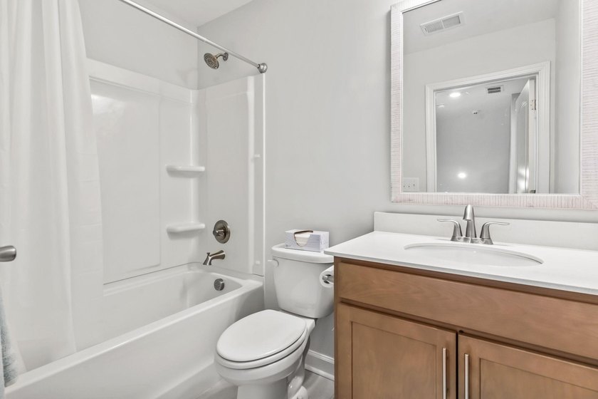 Three-bedroom, three-bathroom Craftsman-style home with a - photo 24