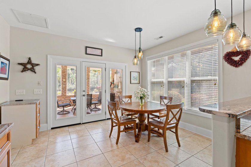 Nestled in a beautiful lakefront setting, this all-brick - photo 12