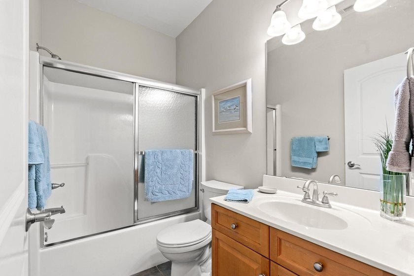 Nestled in a beautiful lakefront setting, this all-brick - photo 31