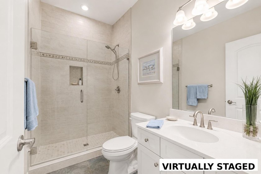 Nestled in a beautiful lakefront setting, this all-brick - photo 32