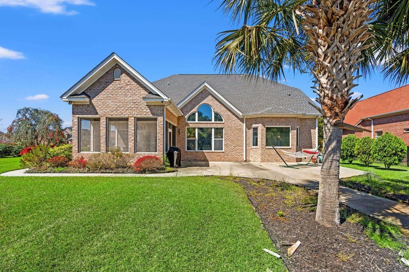 Nestled in a beautiful lakefront setting, this all-brick - photo 47