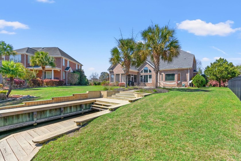 Nestled in a beautiful lakefront setting, this all-brick - photo 49