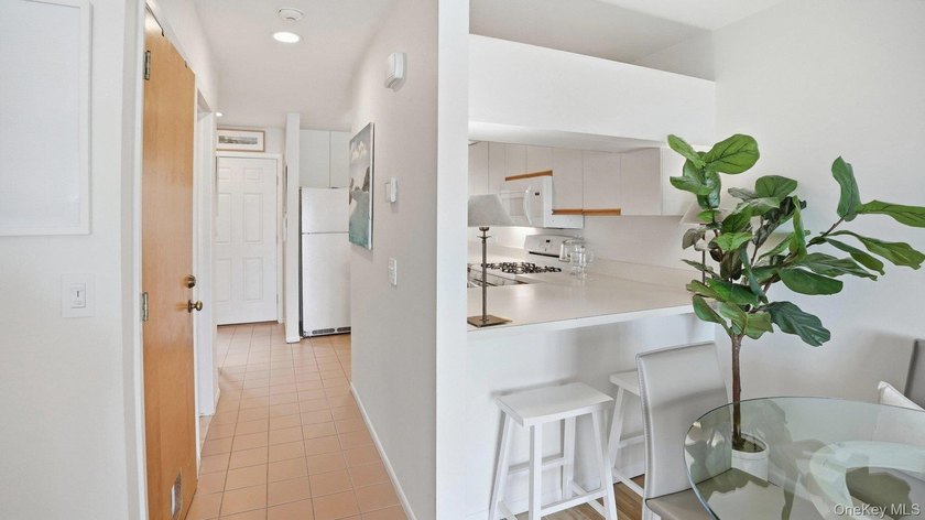 Welcome to 49 Canoe Place Rd, Unit 416, a charming coastal - photo 17