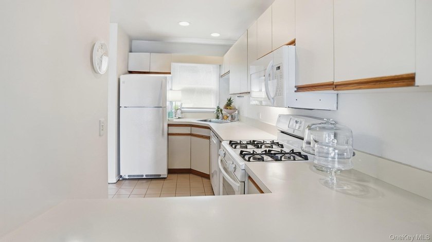 Welcome to 49 Canoe Place Rd, Unit 416, a charming coastal - photo 18