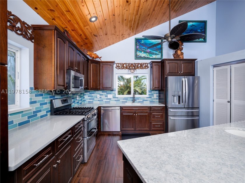 A rare waterfront estate along a 200-foot wide canal with a - photo 19