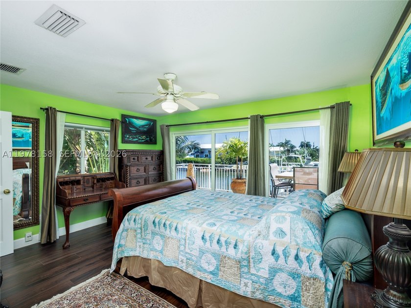 A rare waterfront estate along a 200-foot wide canal with a - photo 27