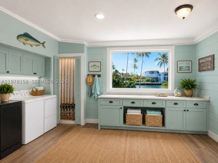 A rare waterfront estate along a 200-foot wide canal with a - photo 35
