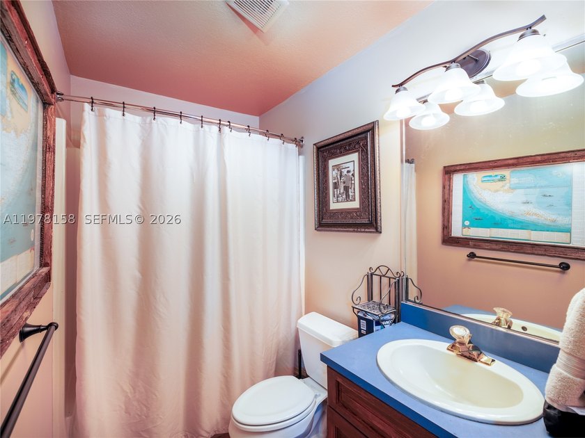 A rare waterfront estate along a 200-foot wide canal with a - photo 37