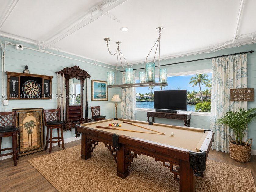 A rare waterfront estate along a 200-foot wide canal with a - photo 49