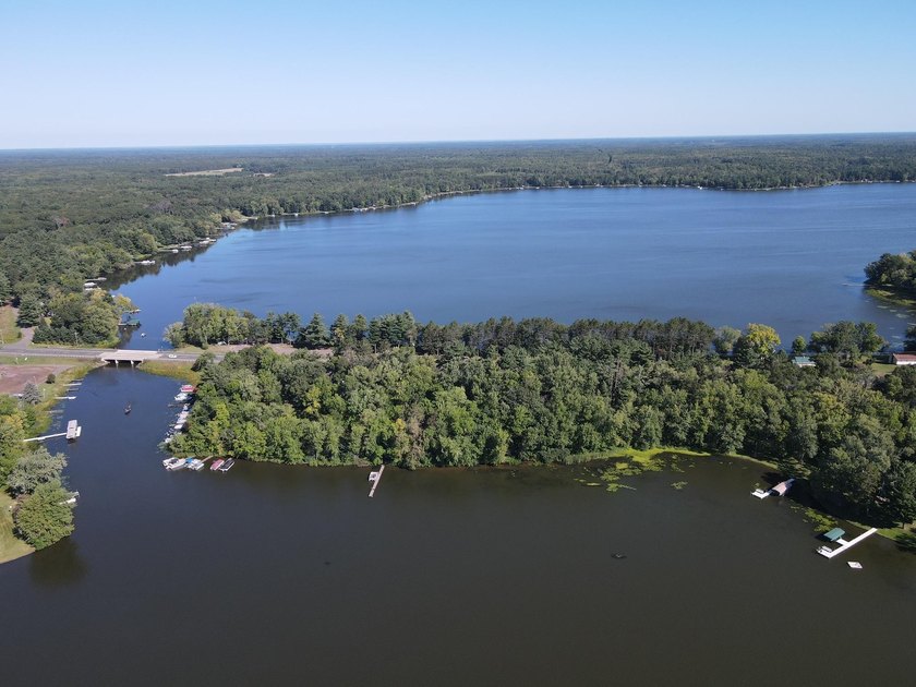 This 1.3-acre wooded lot offers 258 feet of pristine lakeshore - photo 3