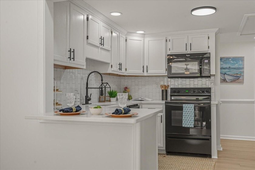 Escape to lake life in this beautifully updated one-story - photo 12