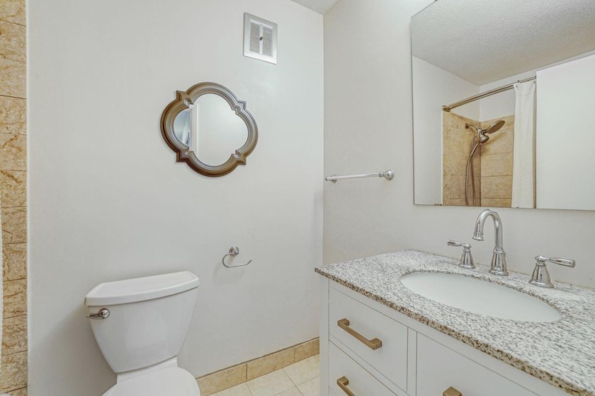 Move right into this top-floor, one-level home offering - photo 11
