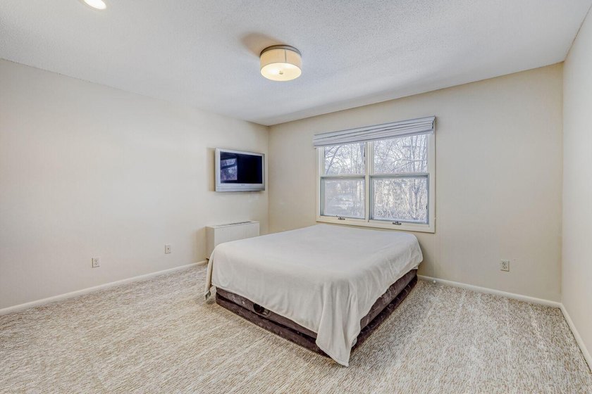 Move right into this top-floor, one-level home offering - photo 12