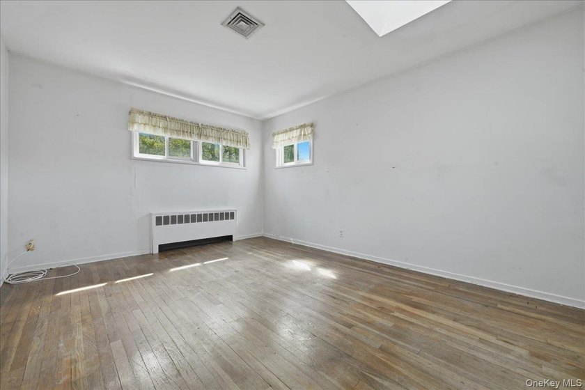 Spacious split-level home set on a huge, private wooded property - photo 15