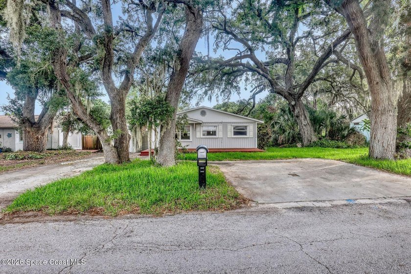 PRICED TO SELL! Cottage charm meets coastal opportunity! Tucked - photo 3