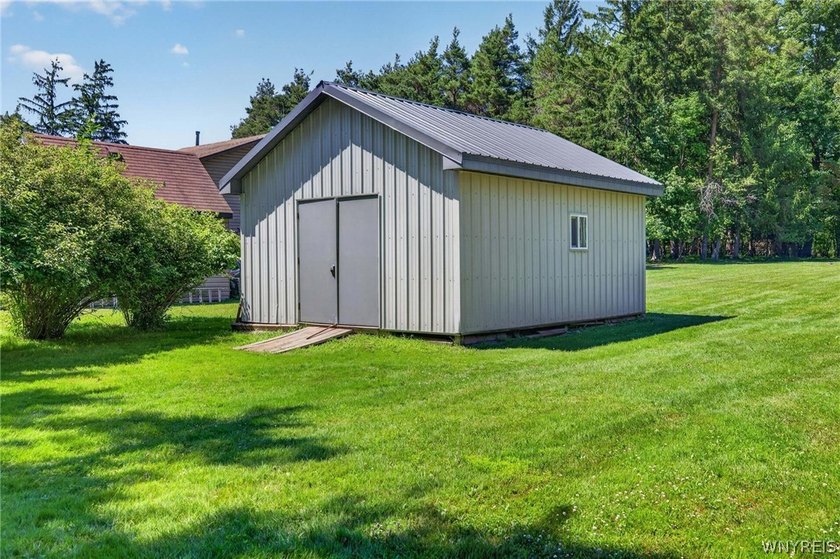 Welcome to 1890 Center Road in West Seneca! Set on 1.2 beautiful - photo 40