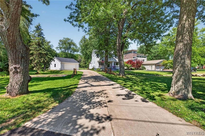 Welcome to 1890 Center Road in West Seneca! Set on 1.2 beautiful - photo 44