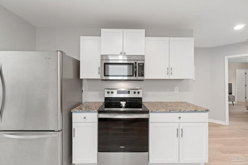 This beautifully designed 3-bedroom, 2-bath new construction - photo 3