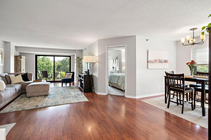 Welcome home to this beautifully updated corner unit offering an - photo 2