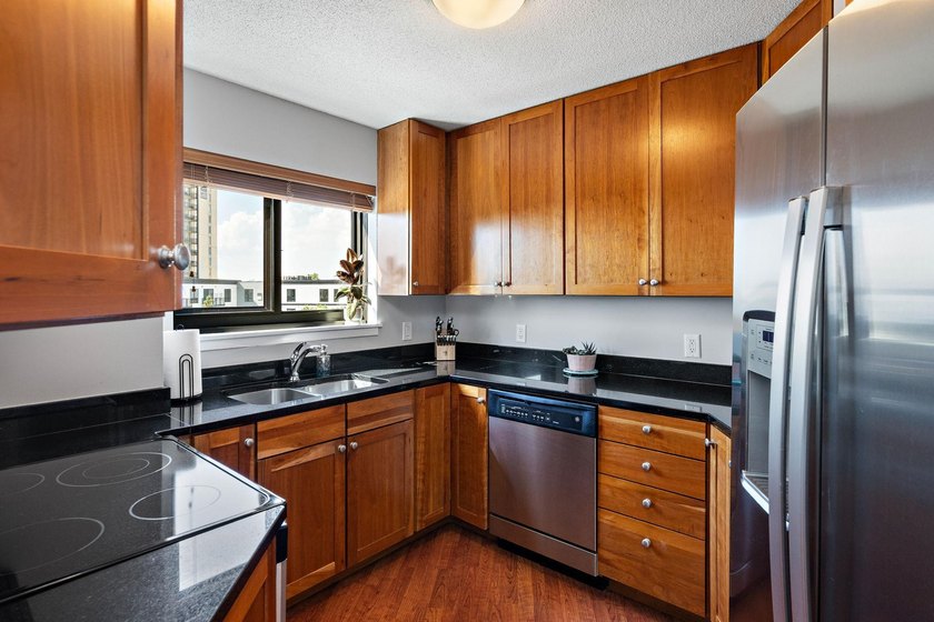 Welcome home to this beautifully updated corner unit offering an - photo 6