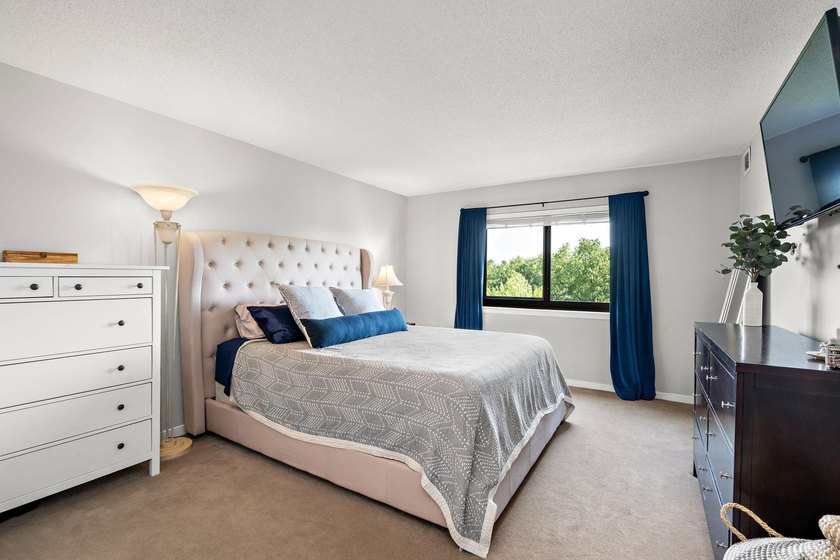 Welcome home to this beautifully updated corner unit offering an - photo 10