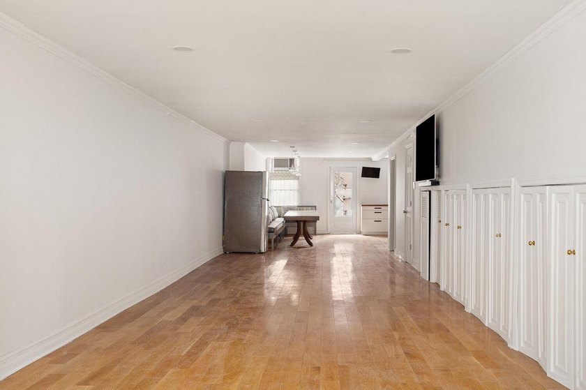 213 East 120th Street presents a compelling four-unit, mixed-use - photo 2