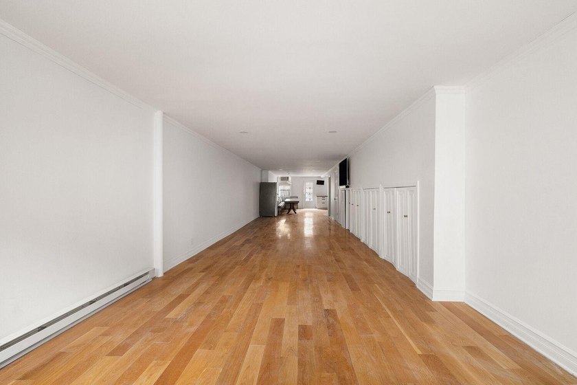 213 East 120th Street presents a compelling four-unit, mixed-use - photo 3