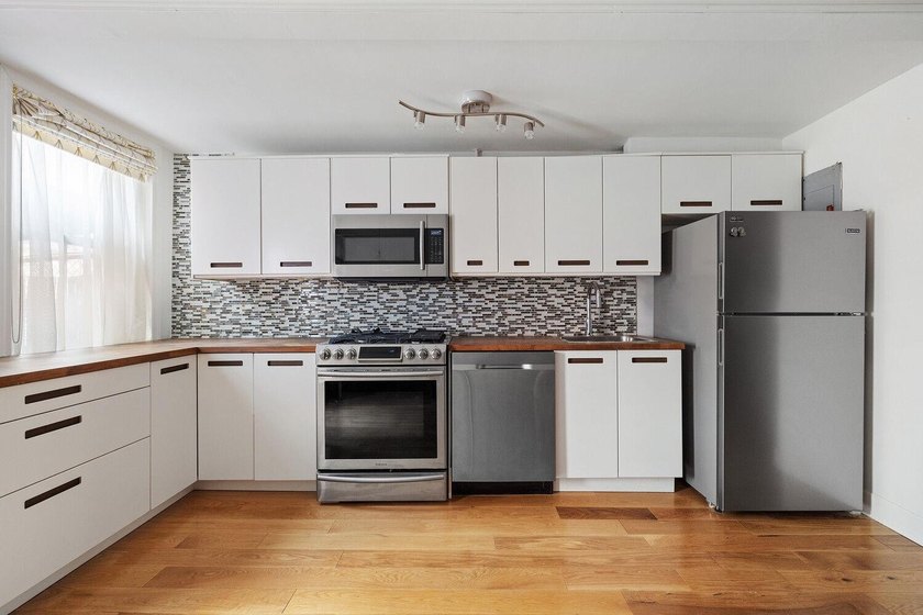 213 East 120th Street presents a compelling four-unit, mixed-use - photo 4