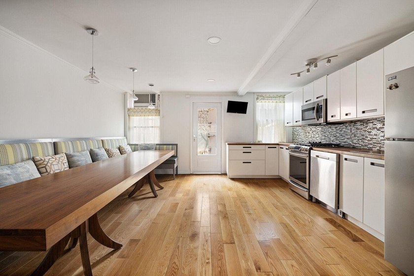 213 East 120th Street presents a compelling four-unit, mixed-use - photo 5