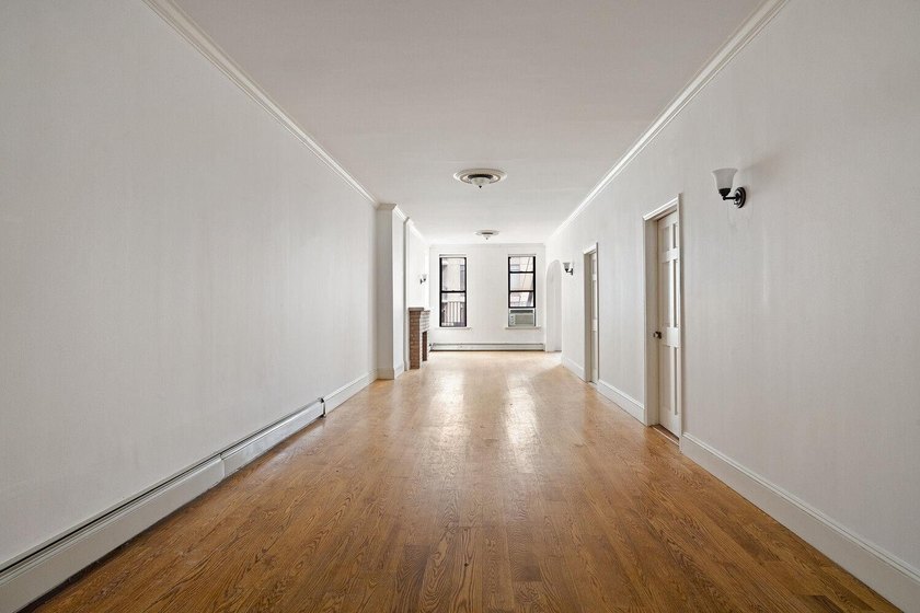 213 East 120th Street presents a compelling four-unit, mixed-use - photo 6
