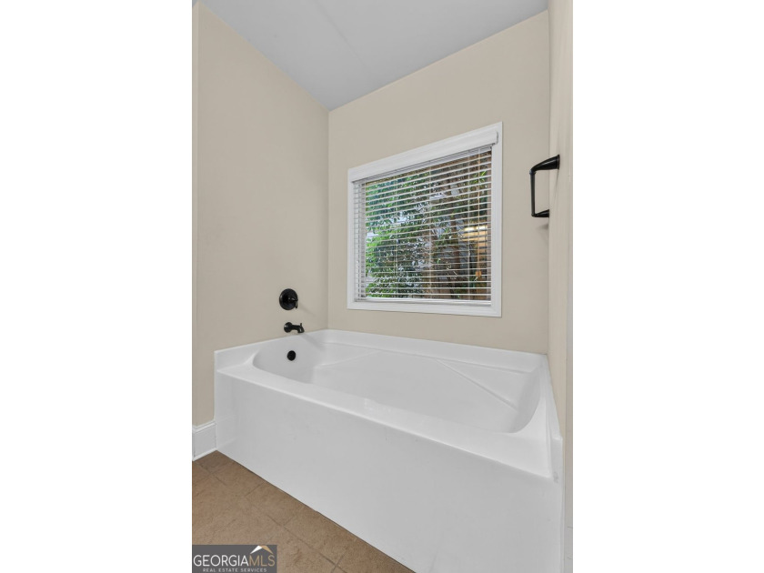 This charming 3-bedroom, 2-bath home is nestled in the sought - photo 22