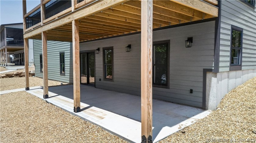 Stunning new-construction waterfront home at the Lake of the - photo 11
