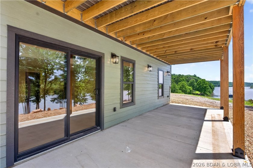 Stunning new-construction waterfront home at the Lake of the - photo 13