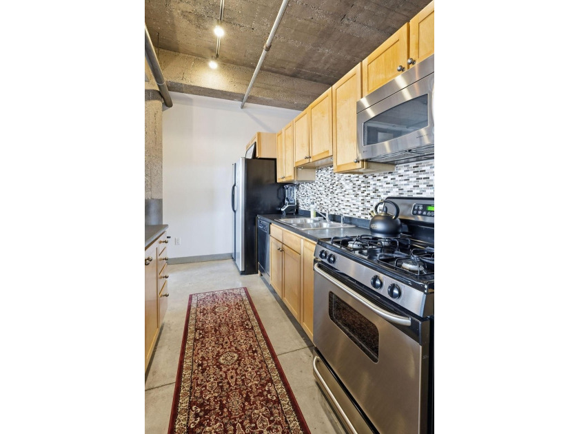 Discover authentic North Loop loft living in this bright - photo 7