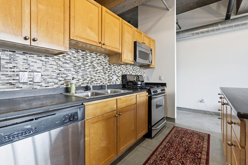 Discover authentic North Loop loft living in this bright - photo 8