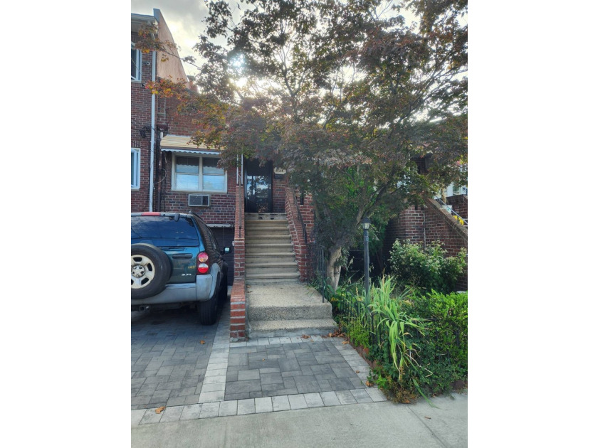 Welcome to this move-in ready brick two-family home nestled in - photo 2