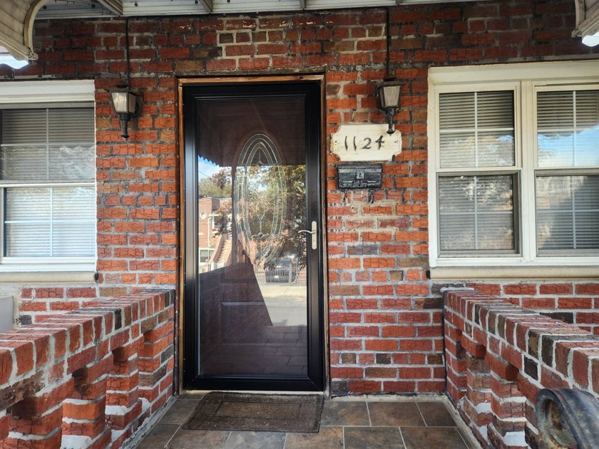 Welcome to this move-in ready brick two-family home nestled in - photo 3