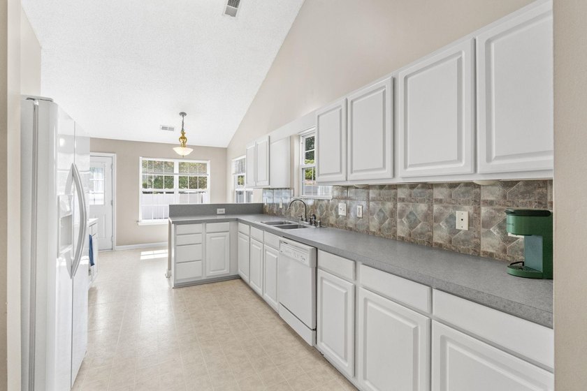 Welcome to this move-in ready 3-bedroom, 2-bath home in the - photo 13
