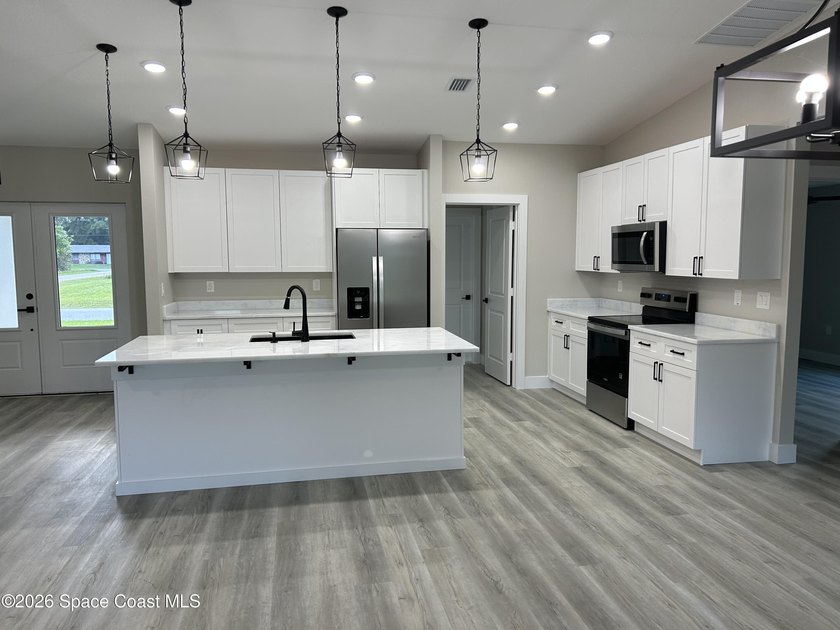Luxury meets functionality in this exceptional new construction - photo 5