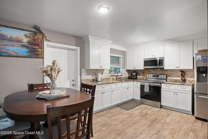 Welcome to this well-maintained concrete block 4 bedroom, 2-bath - photo 7