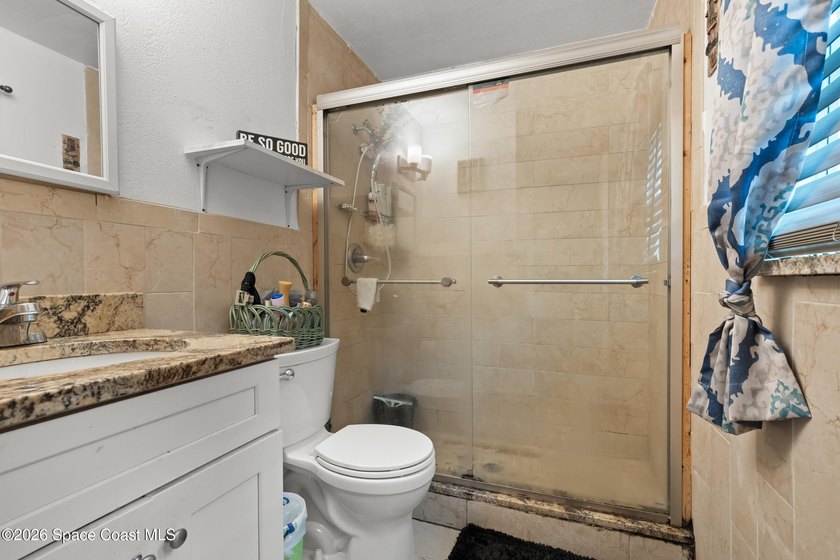 Welcome to this well-maintained concrete block 4 bedroom, 2-bath - photo 10